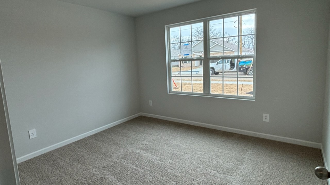 Bedroom in modern, open concept new home