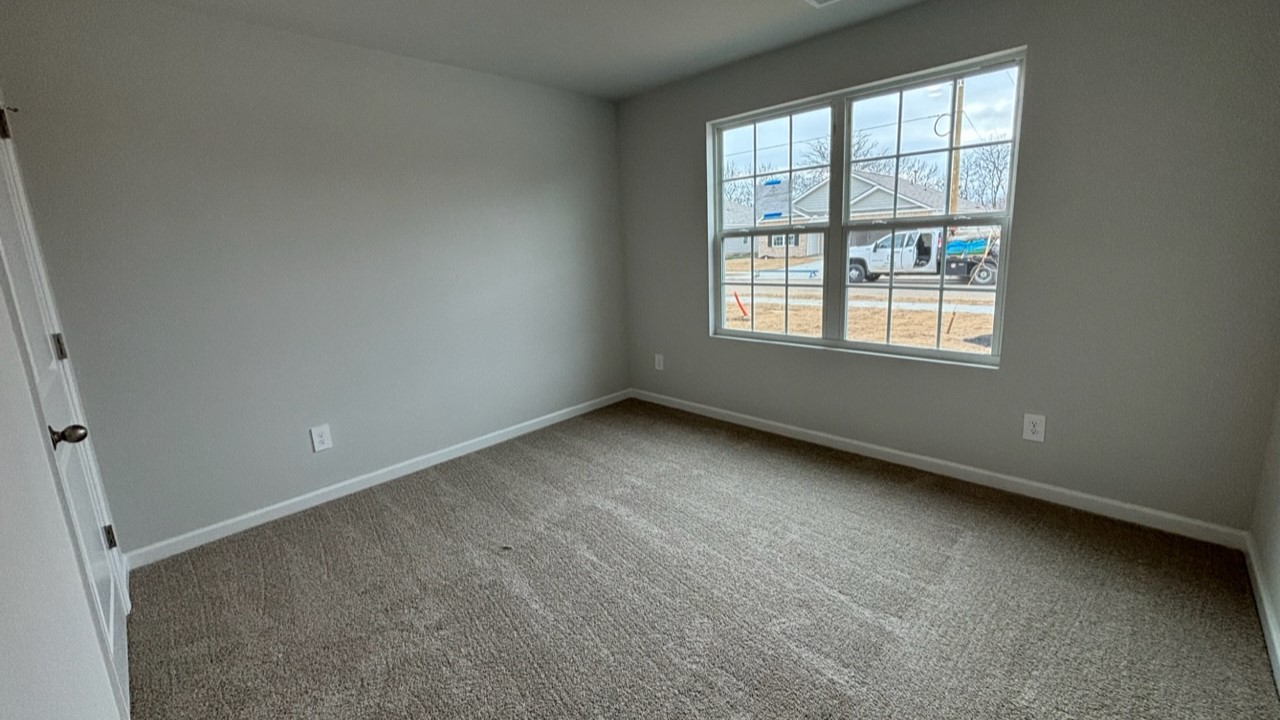 Bedroom in modern, open concept new home