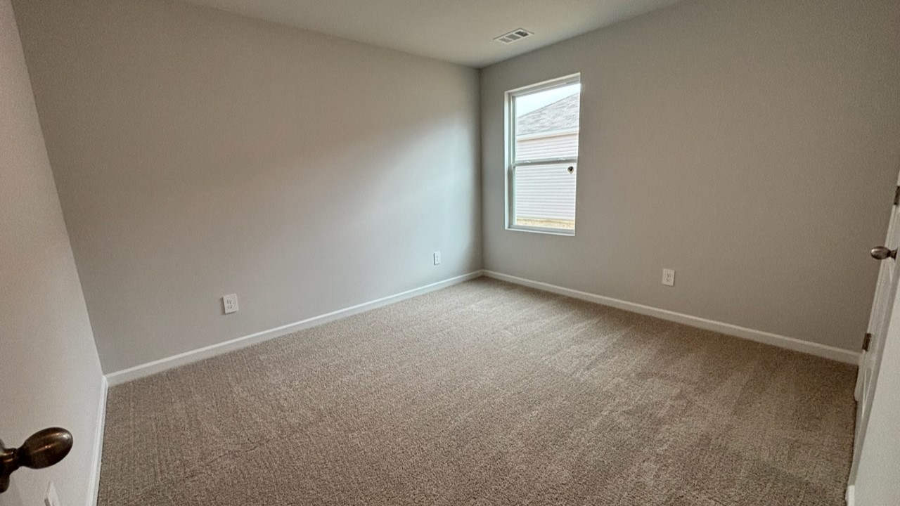 Bedroom in modern, open concept new home