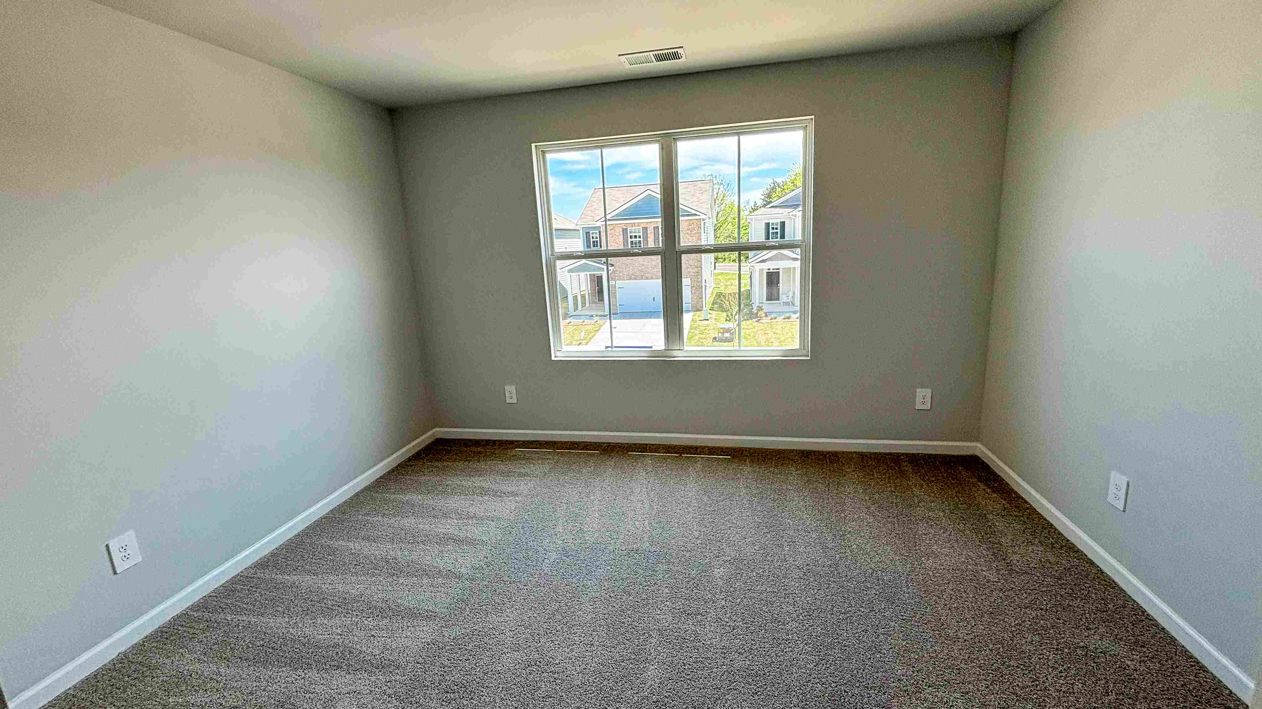 Bedroom in modern, open concept new home