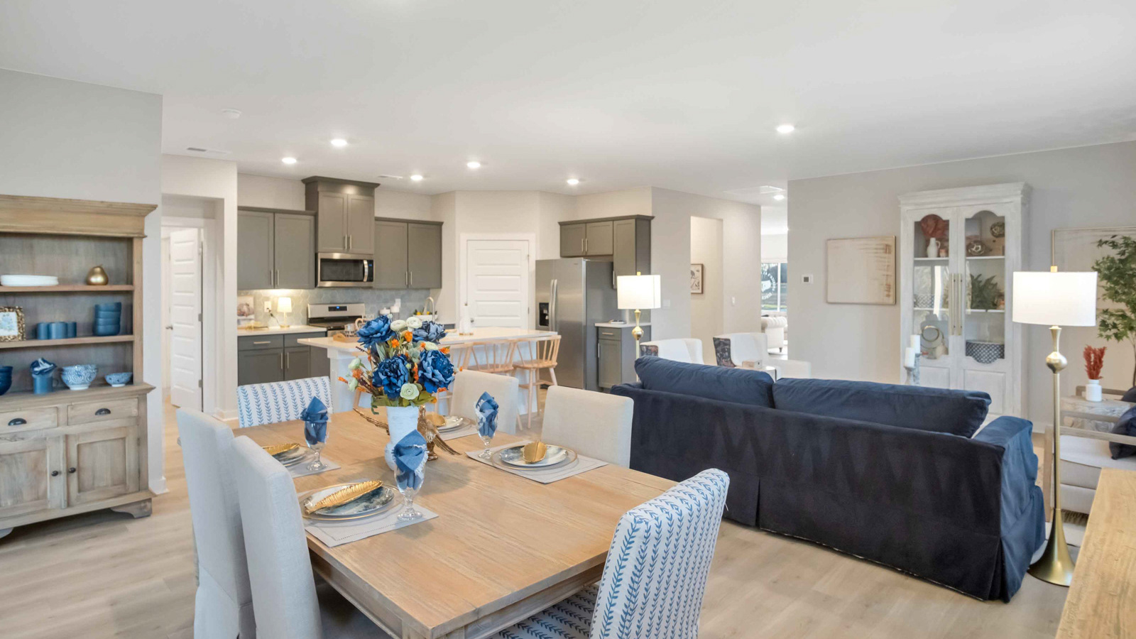 Dining room in new, open-concept home with windows and natural lighting