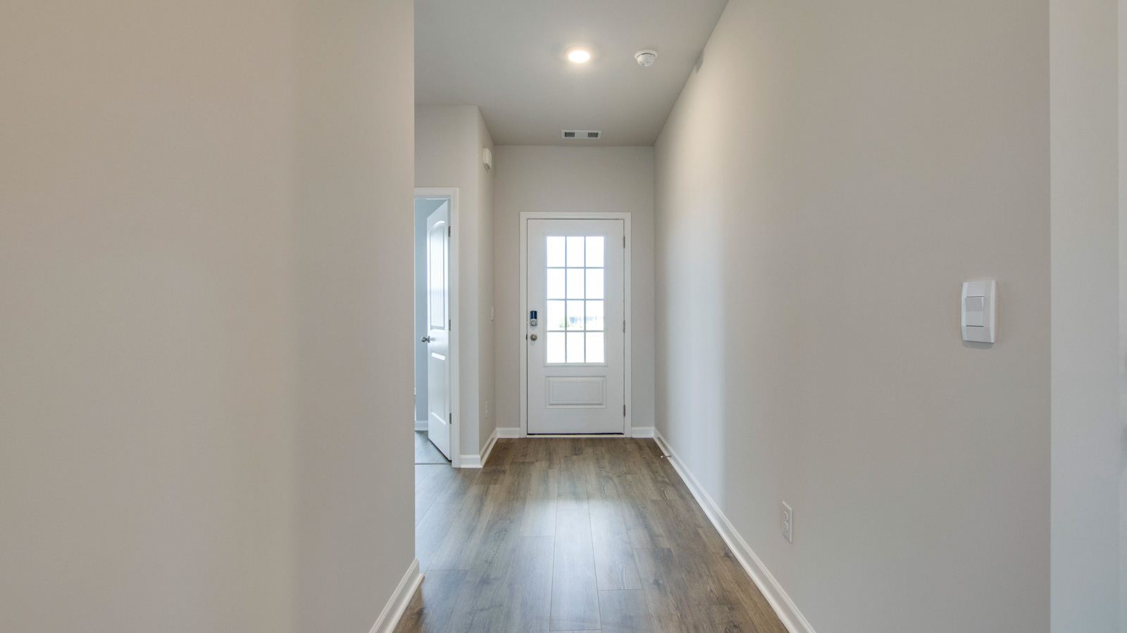 Entry to modern, open concept floorplan