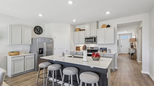 Modern kitchen with quartz countertops and stainless steel appliances
