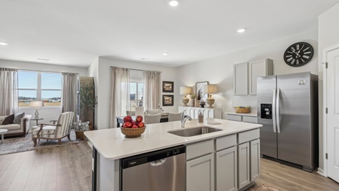 Modern kitchen with quartz countertops and stainless steel appliances