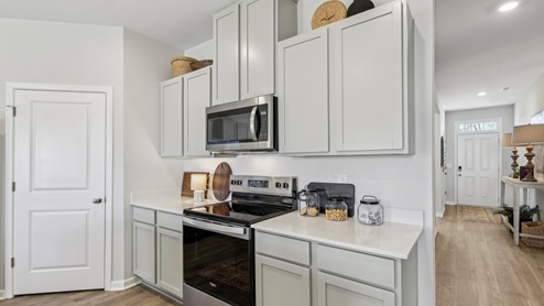 Modern kitchen with quartz countertops and stainless steel appliances