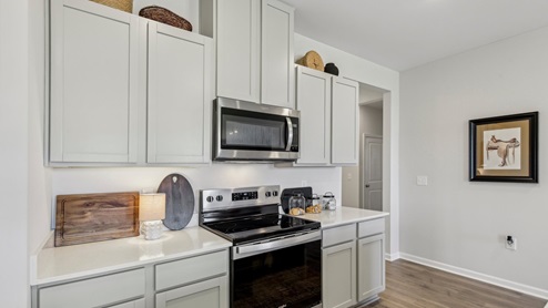 Modern kitchen with quartz countertops and stainless steel appliances