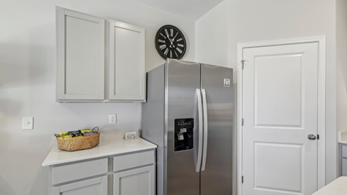 Modern kitchen with quartz countertops and stainless steel appliances