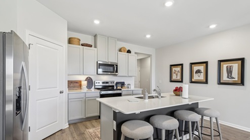 Modern kitchen with quartz countertops and stainless steel appliances