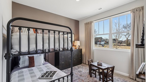 Bedroom in modern, open concept new home