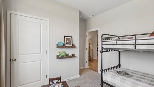 Bedroom in modern, open concept new home