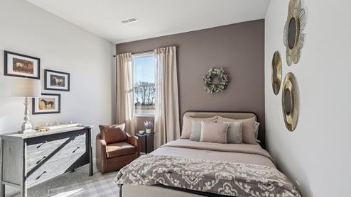 Bedroom in modern, open concept new home