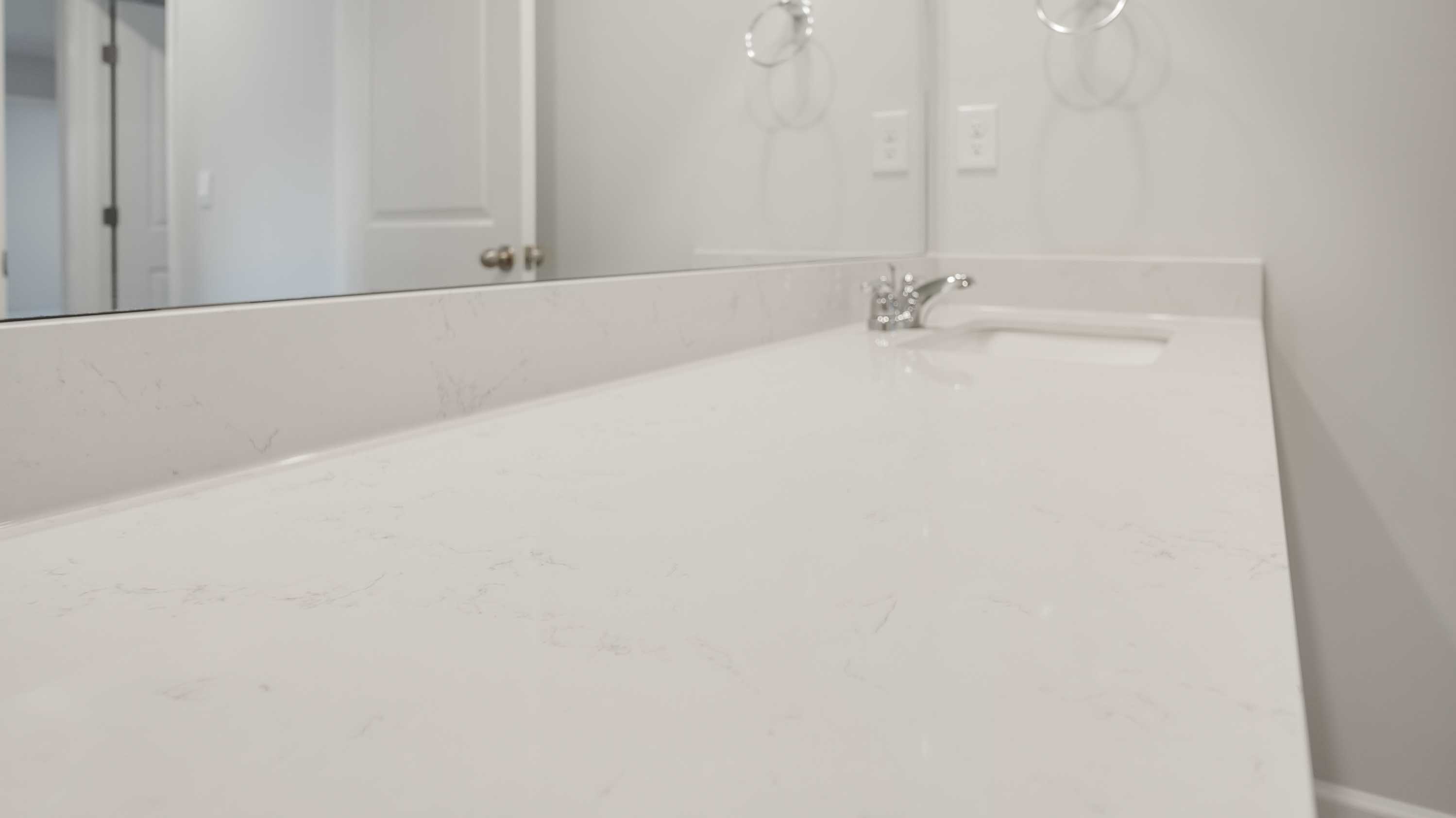 Bathroom with quartz countertops in new home