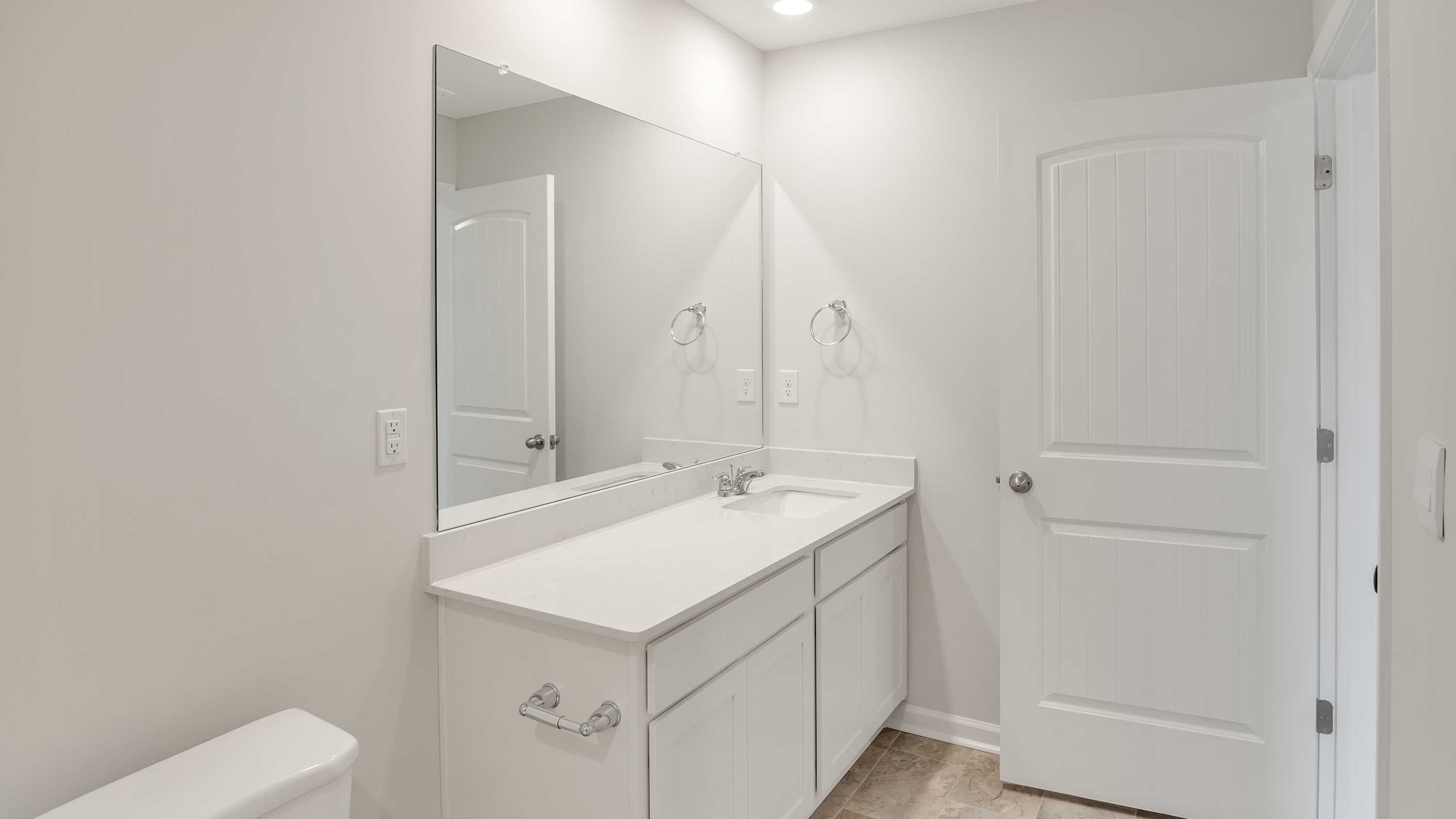 Bathroom with quartz countertops in new home