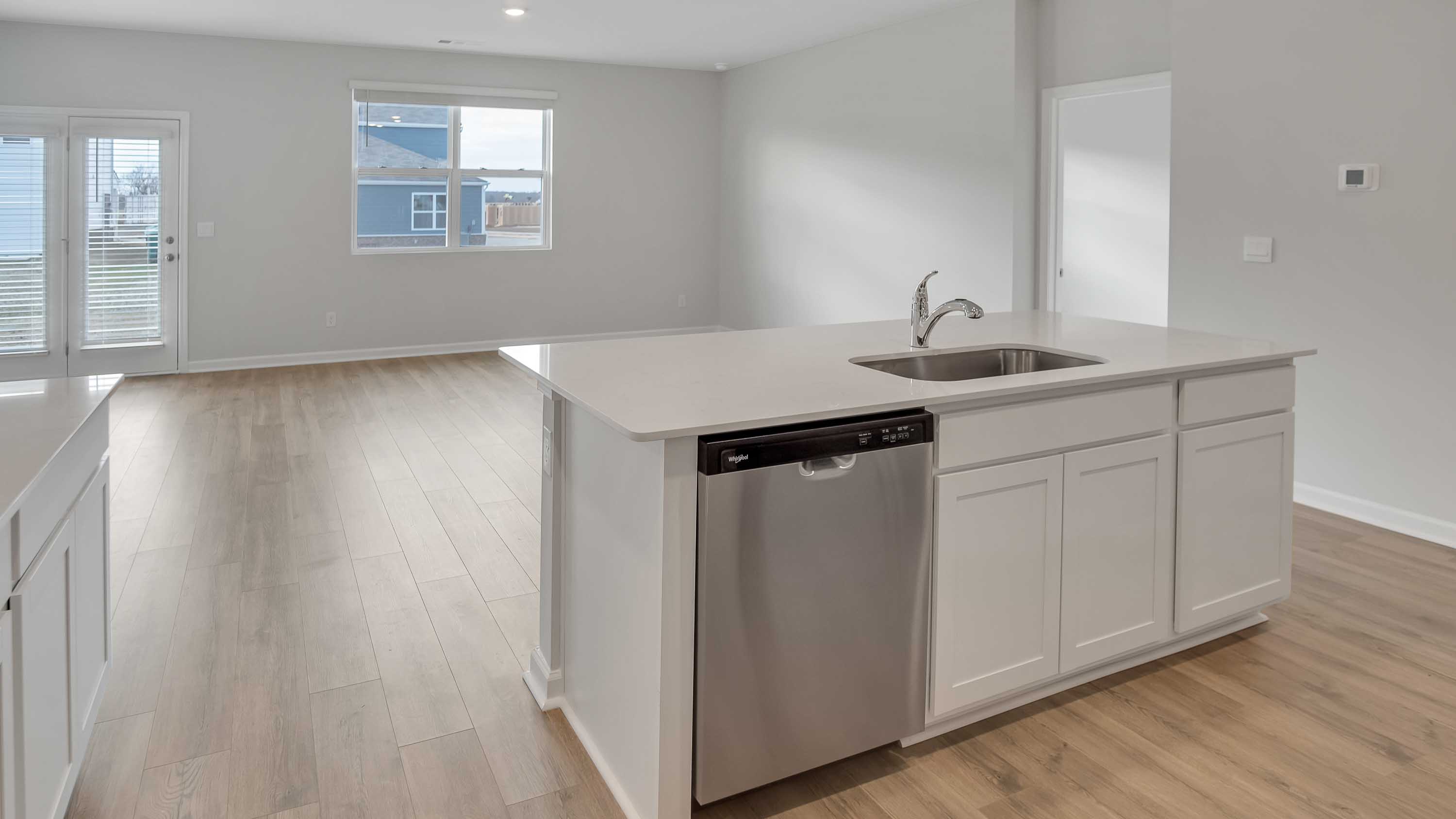 Modern kitchen with quartz countertops and stainless steel appliances
