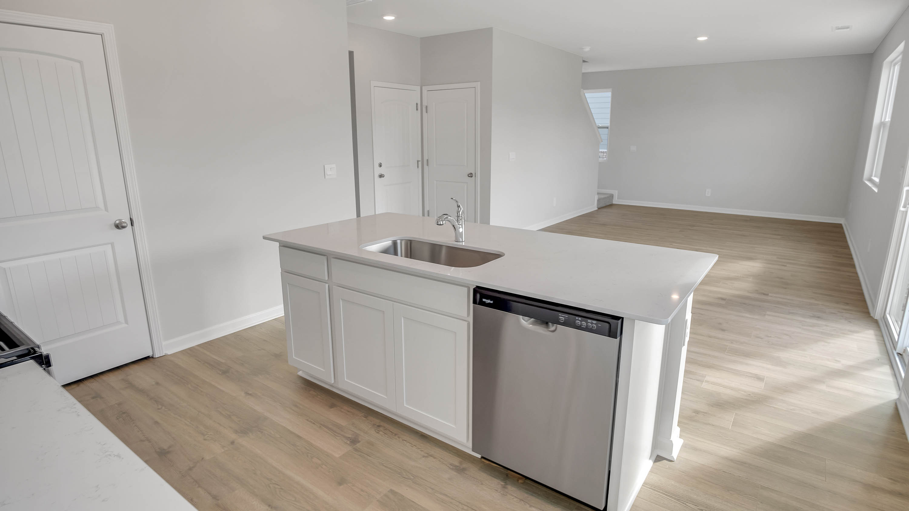 Modern kitchen with quartz countertops and stainless steel appliances