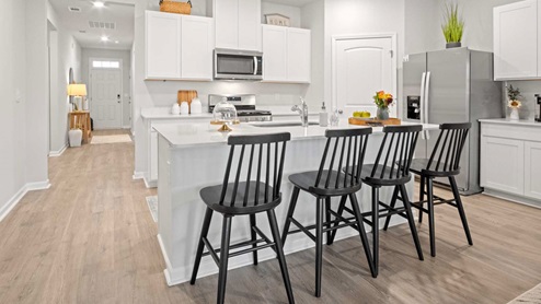Modern kitchen with quartz countertops and stainless steel appliances