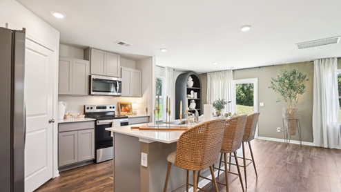 Modern kitchen with quartz countertops and stainless steel appliances