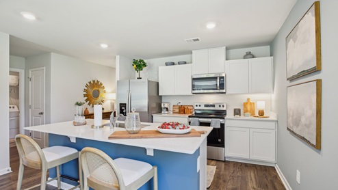 Modern kitchen with quartz countertops and stainless steel appliances