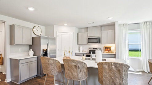Modern kitchen with quartz countertops and stainless steel appliances