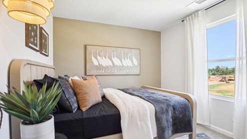 Bedroom in modern, open concept new home