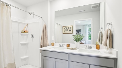 Primary bath quartz countertops in modern, new home