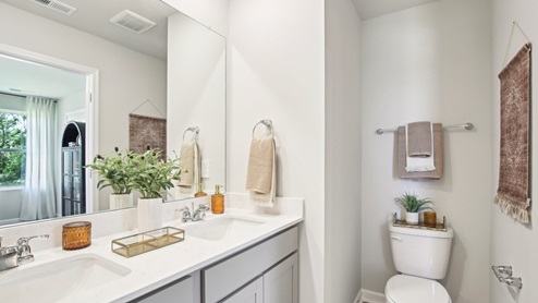 Primary bath quartz countertops in modern, new home