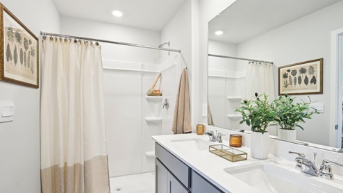 Primary bath quartz countertops in modern, new home