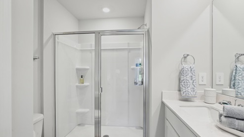 Primary bath quartz countertops in modern, new home