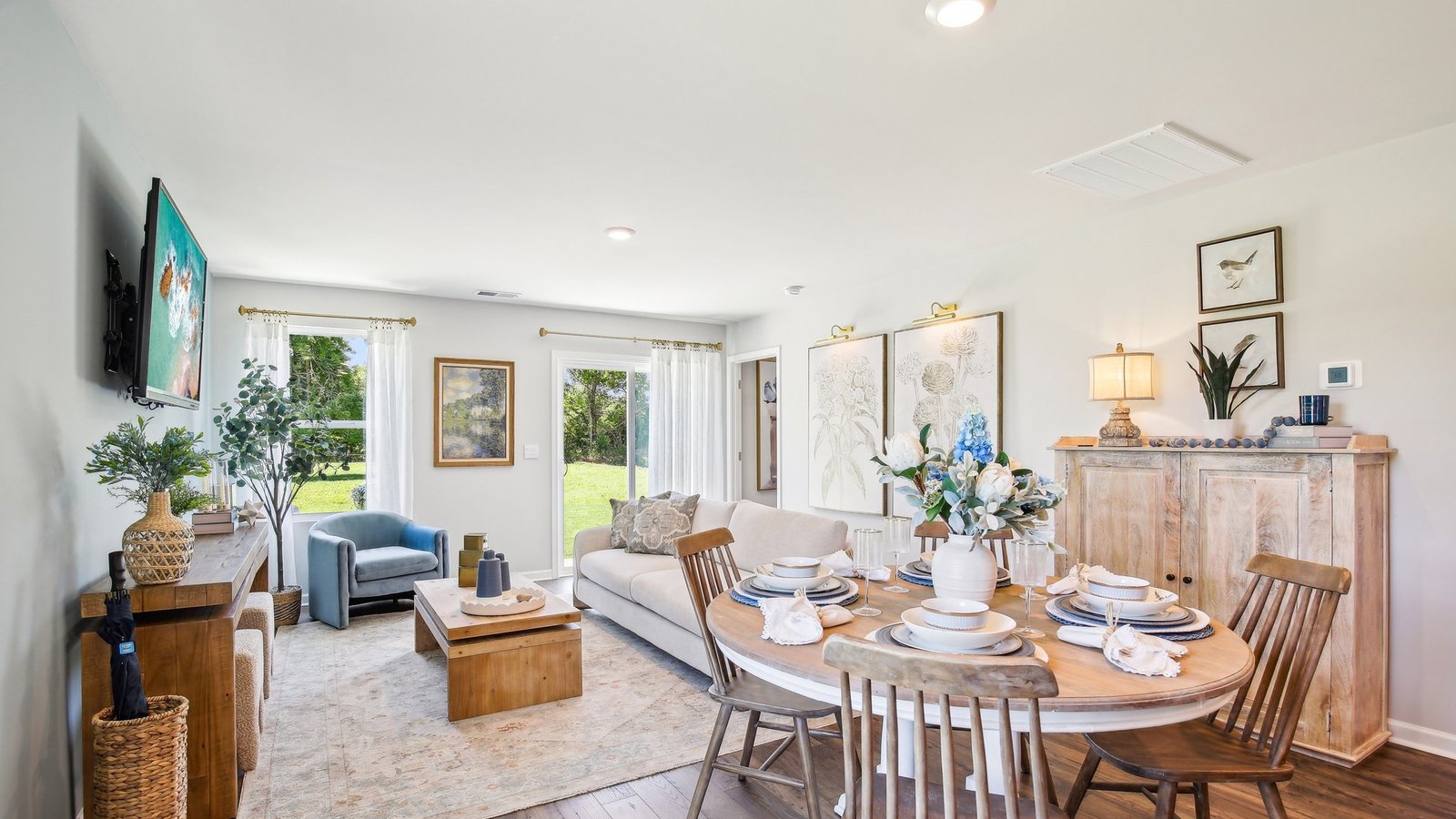 Dining room in new, open-concept home with windows and natural lighting