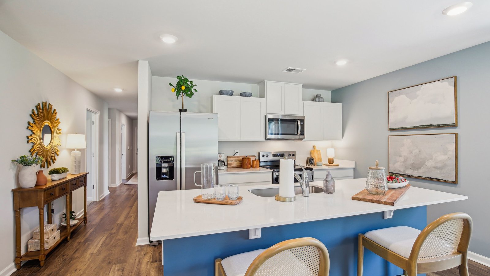 Modern kitchen with quartz countertops and stainless steel appliances