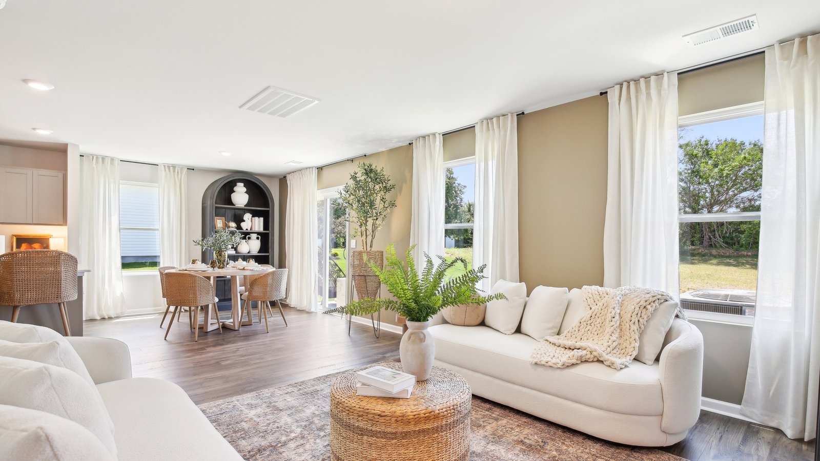 View from living room into dining room, connected to the kitchen, outdoor backyard access at Parkside Point