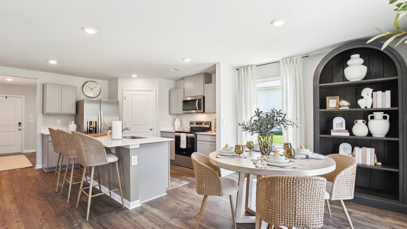 Dining room looking toward modern kitchen island, dining, new appliance suite included at Parkside Point