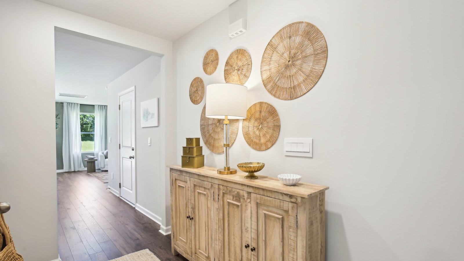 A foyer, entry hall inside front door, next to office, or sitting room adding a welcoming front, direct line of sight to home