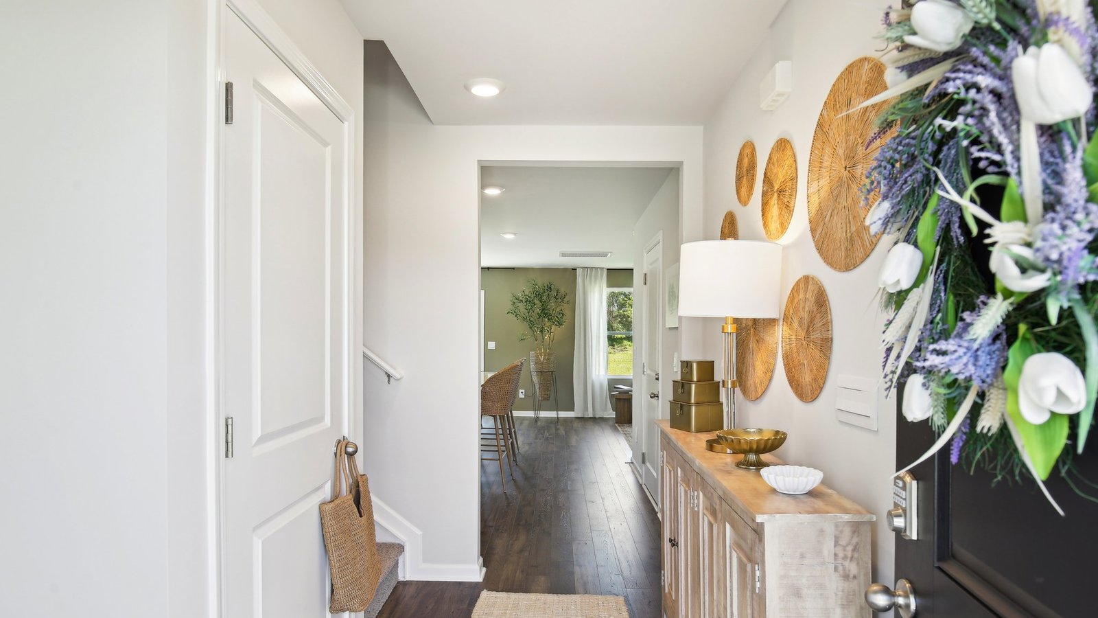 A foyer, entry hall inside front door, next to office, or sitting room adding a welcoming front, direct line of sight to home