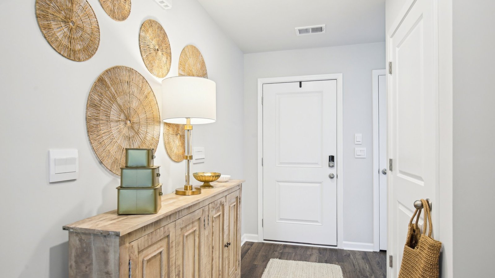 Spacious entry foyer offers clean transitions to stairs, main living areas, office-guest suite access at the front of home