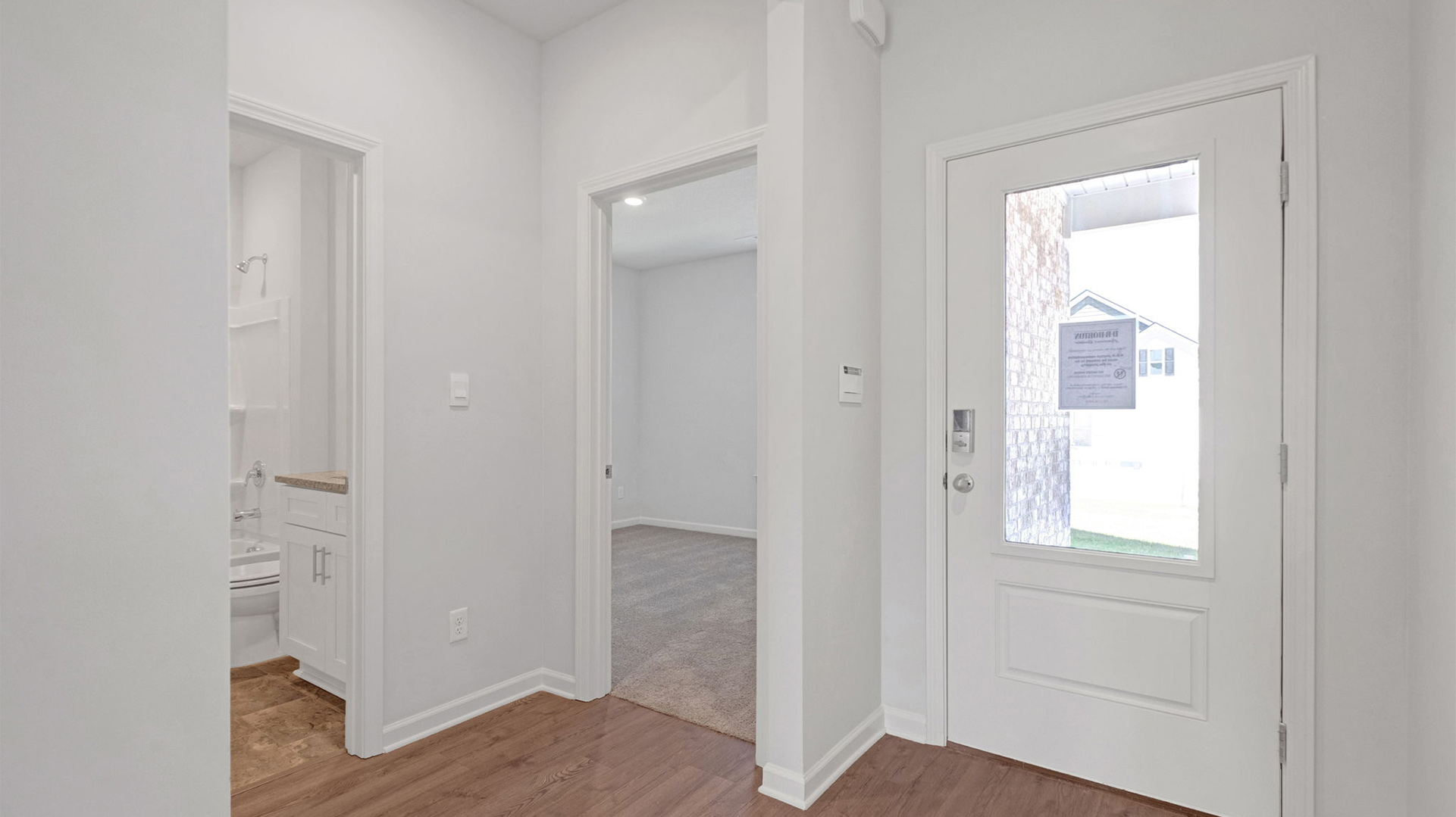 Front door entry with natural light from front door glass insert