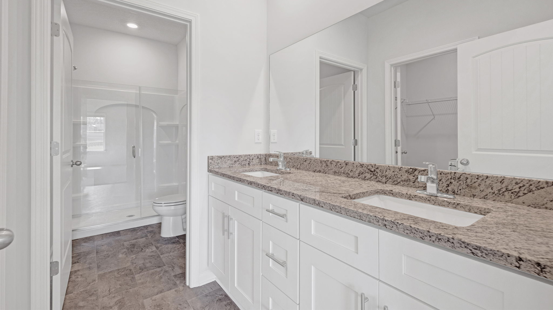 EN suite primary bathroom with a dual vanity