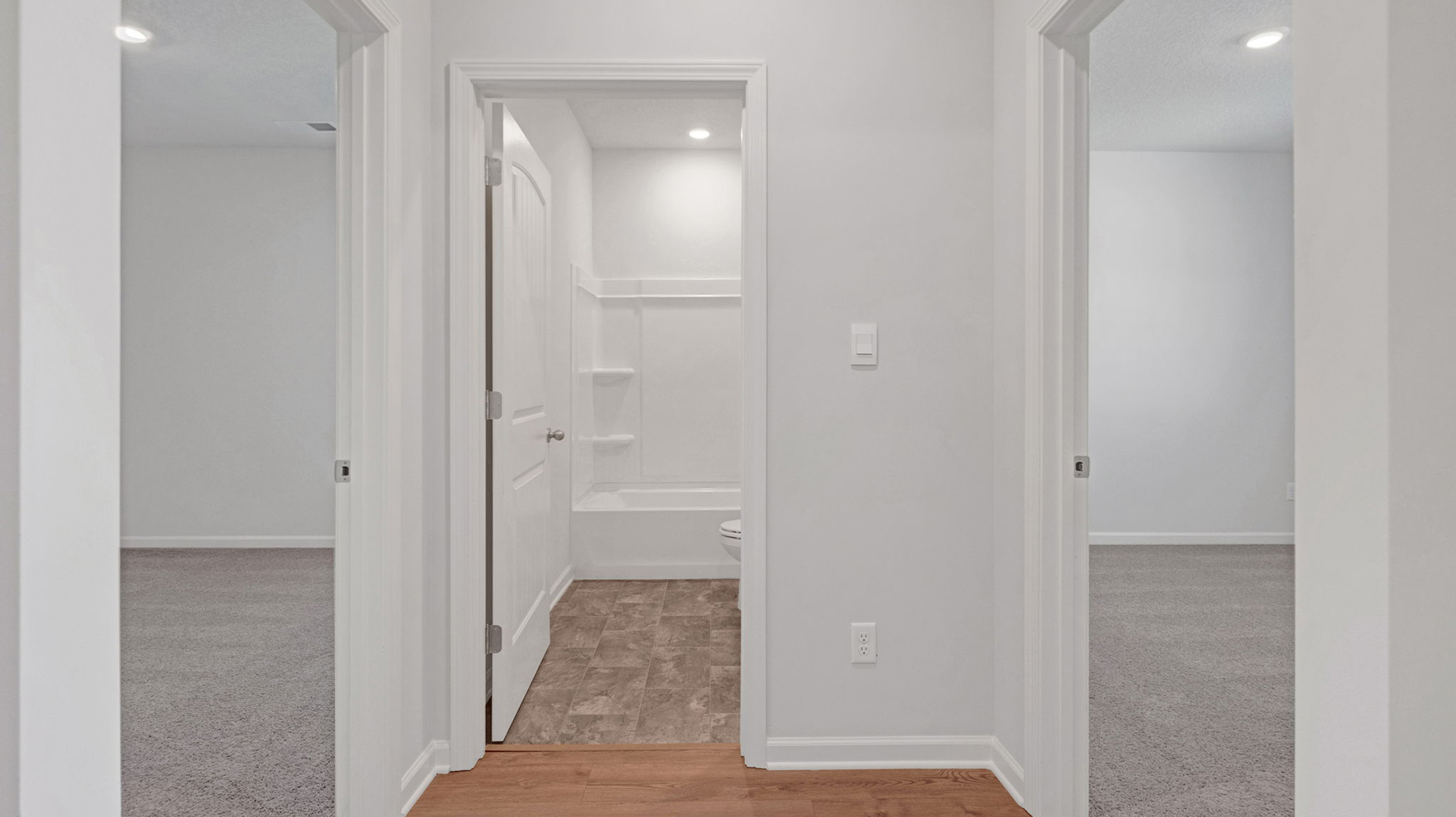 ENtry foyer leading into the guest bathroom