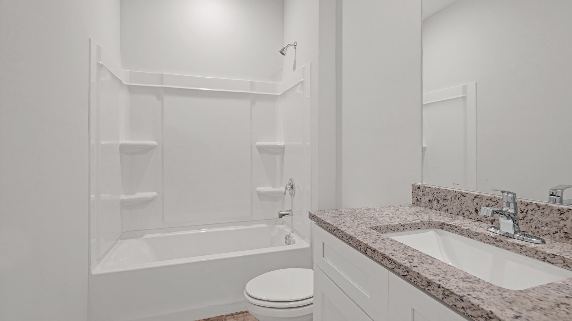 Guest bathroom with an acrlyic tub/shower insert