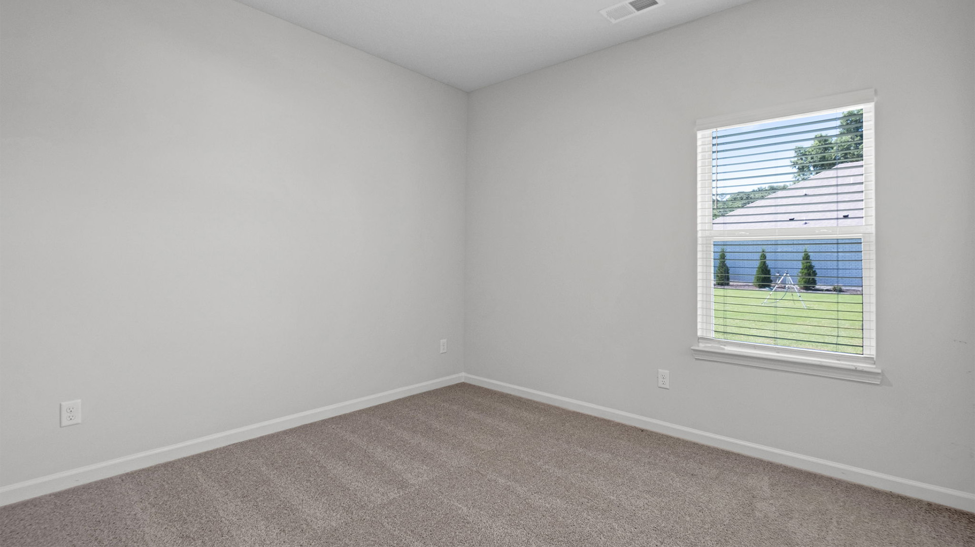 THird bedroom with carpet flooring and neutral paint