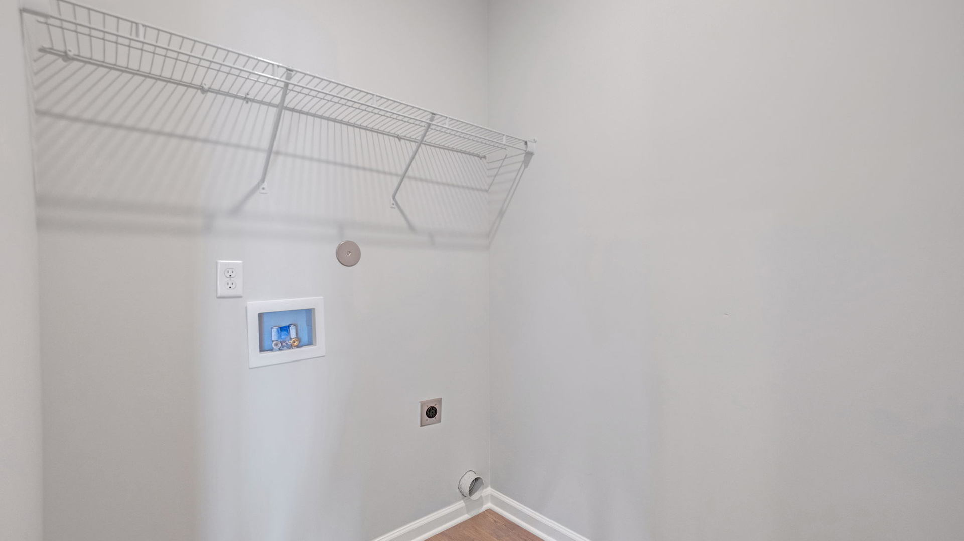 Laundry room with ventilated shelving