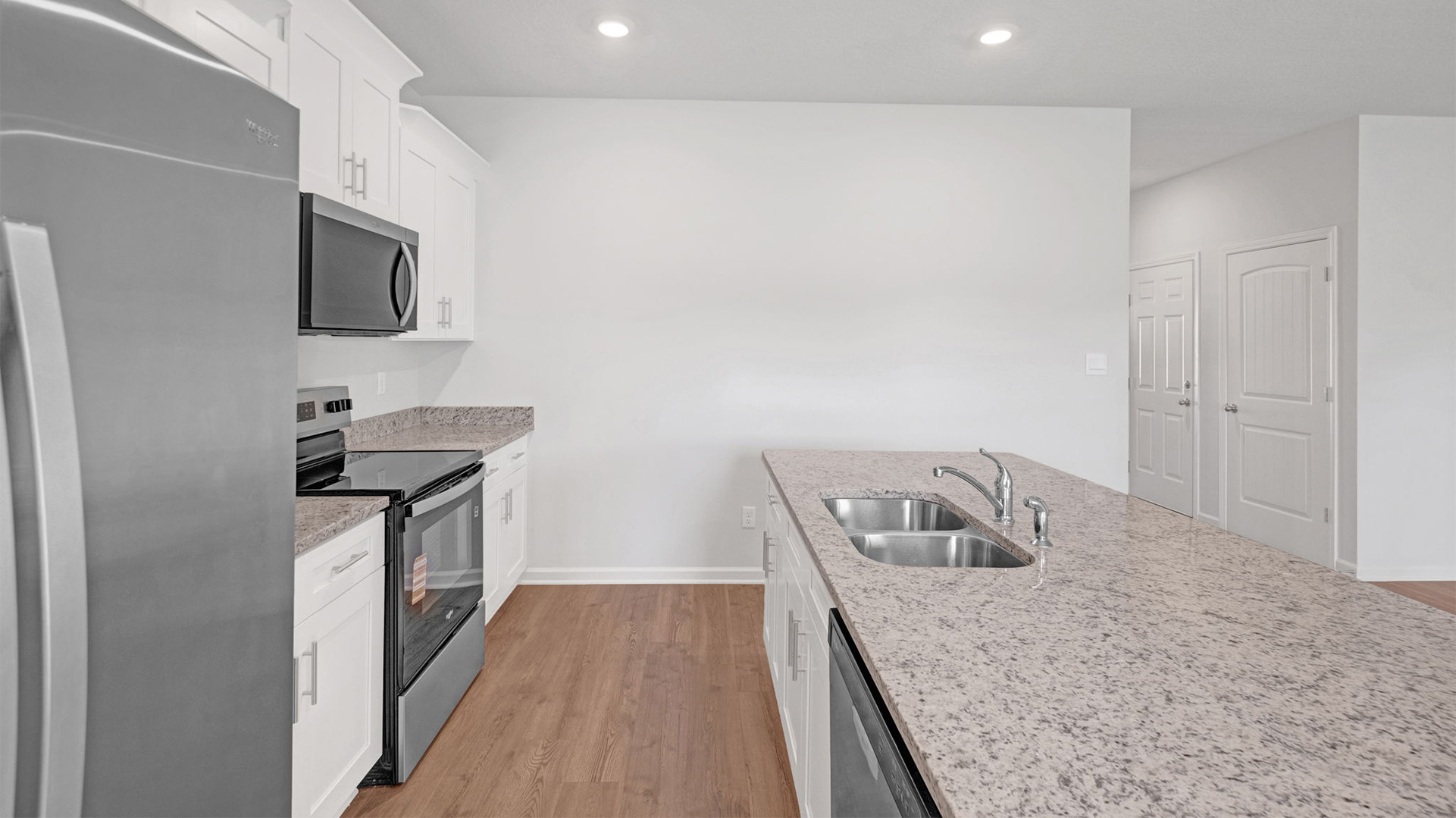 Kitchen island with a stainless steel double bowl sink