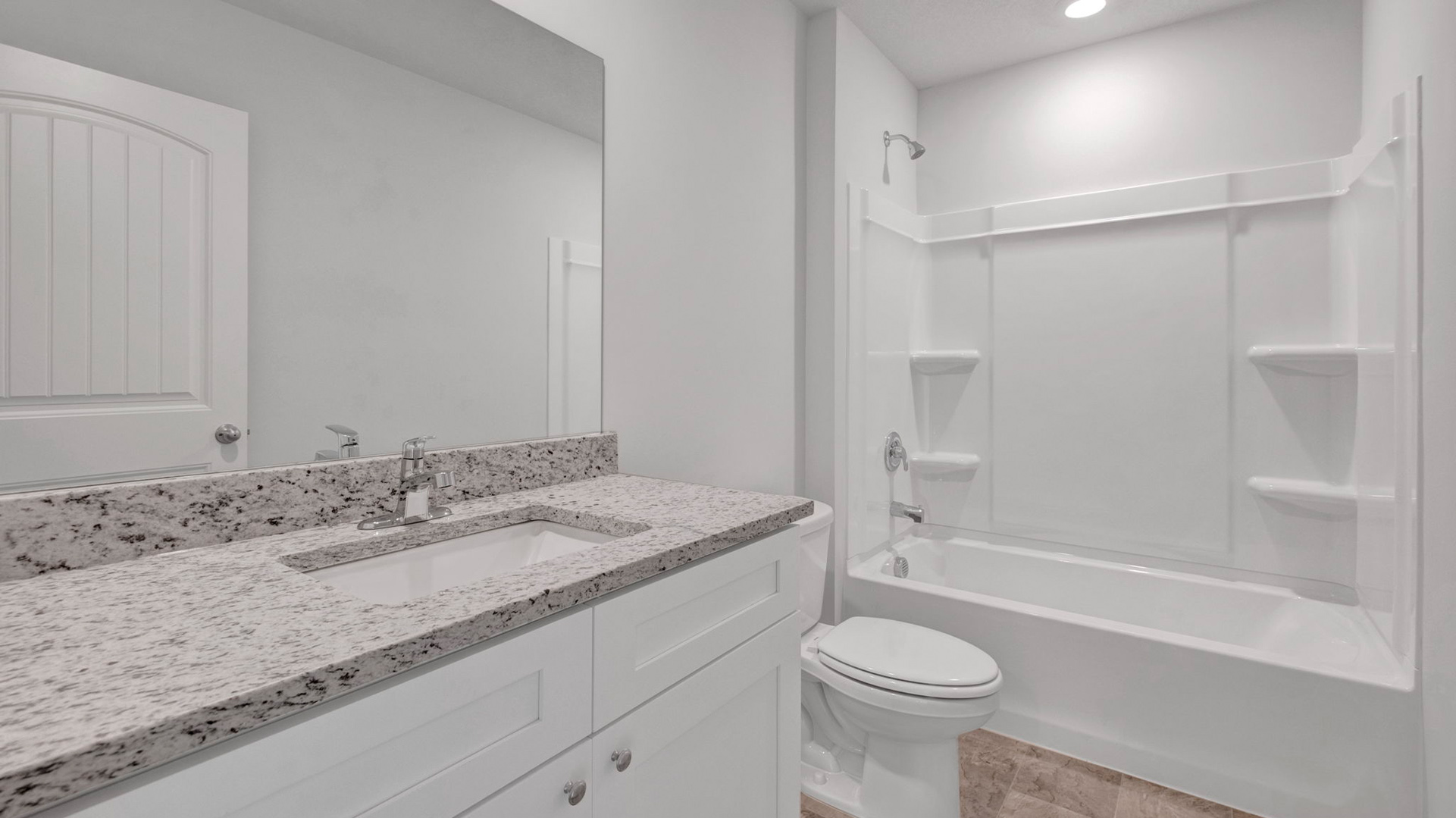 Second bathroom with a single vanity and an acrylic tub/shower insert