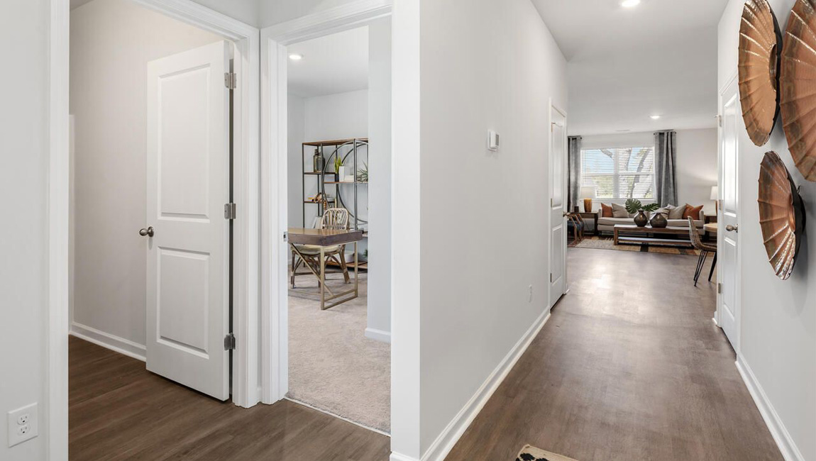 entry hallway with access to bedrooms at the front of the home with a shared bathroom