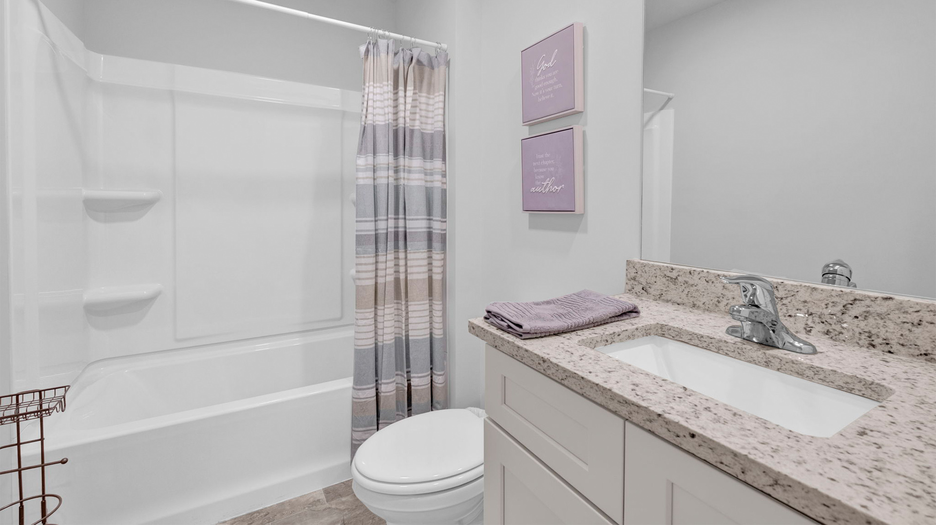 Guest bathroom with a single vanity and an acrylic tub/shower insert