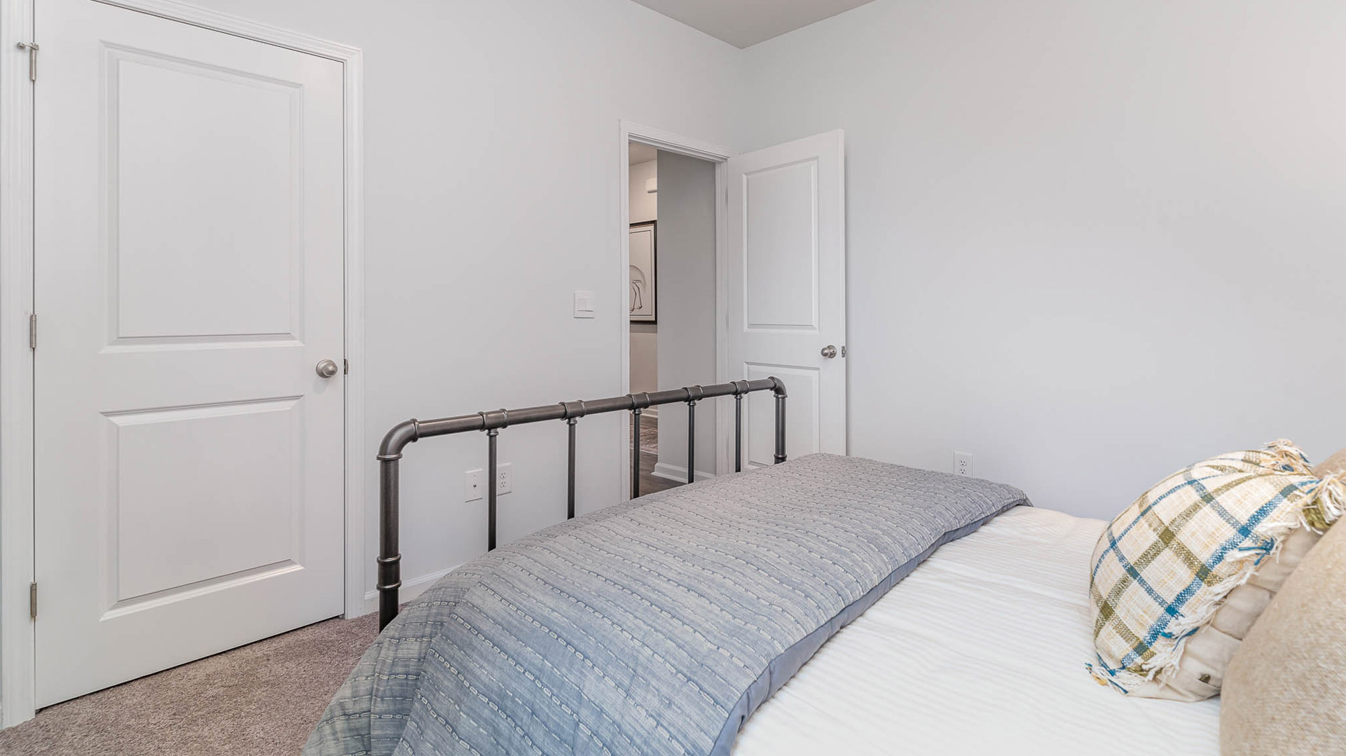 Third bedroom with carpet flooring and neutral paint