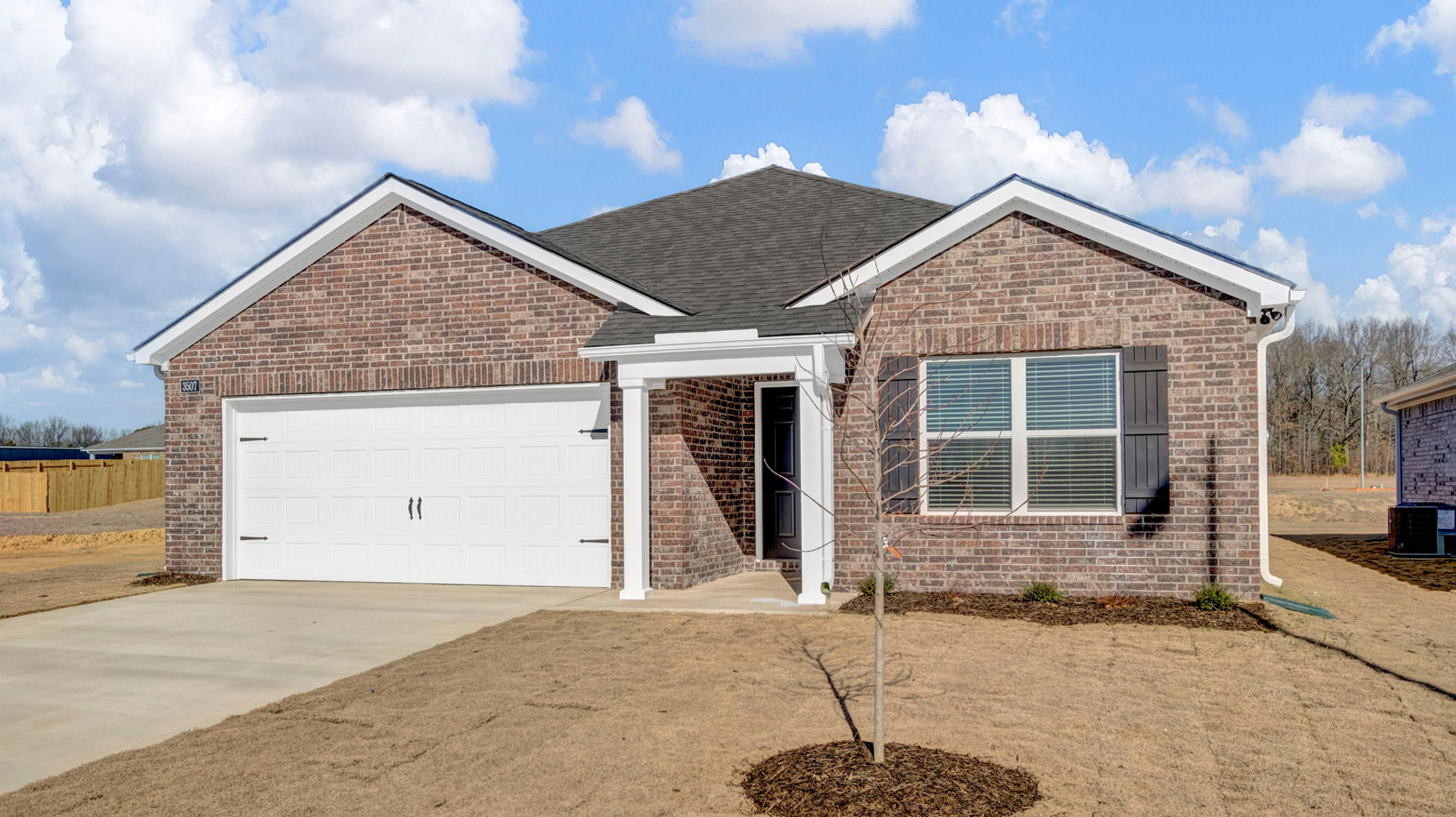 Exterior elevation of the Aria, a single story home with a two car garage
