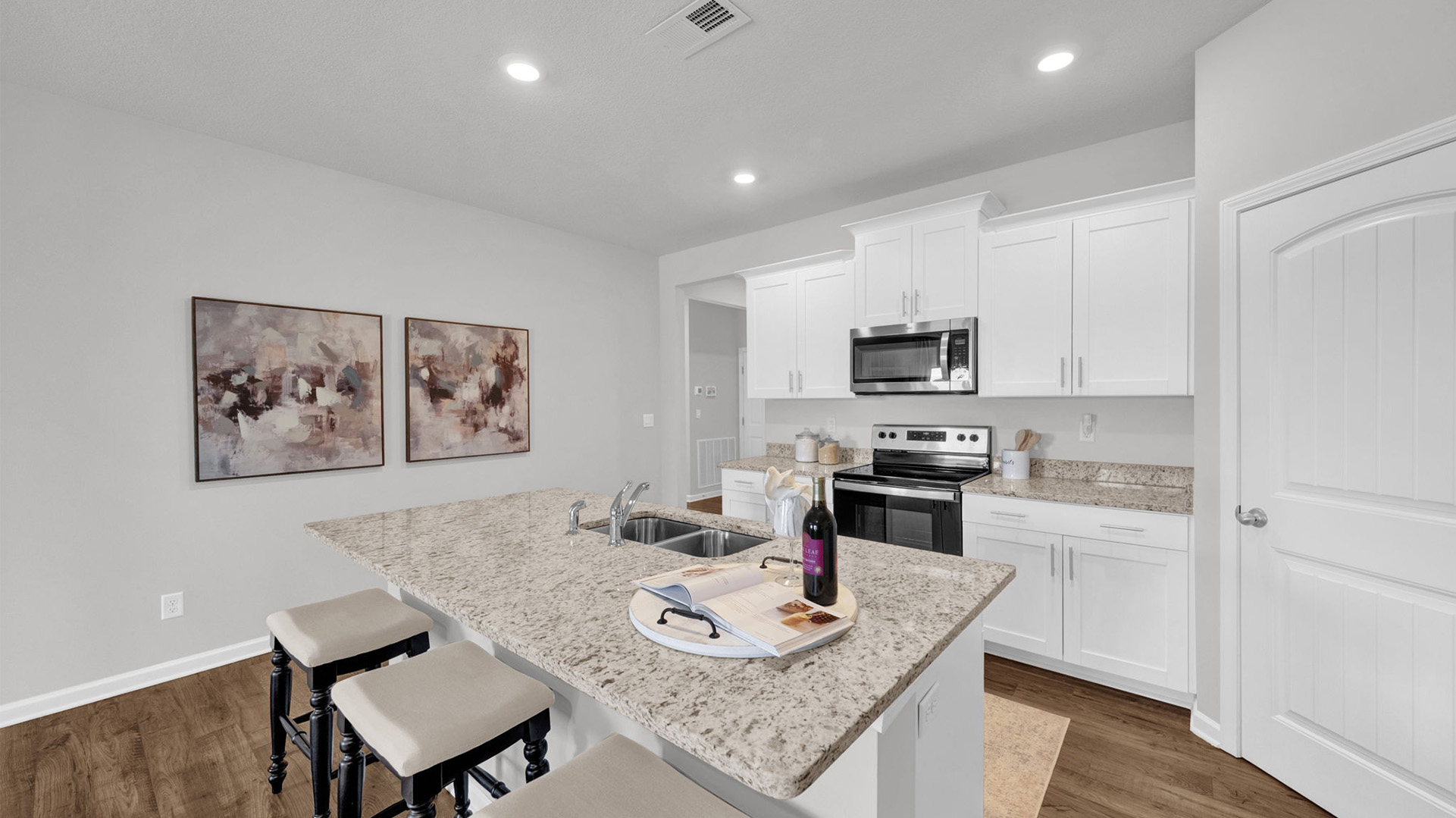 Open view of the kitchen with granite countertops