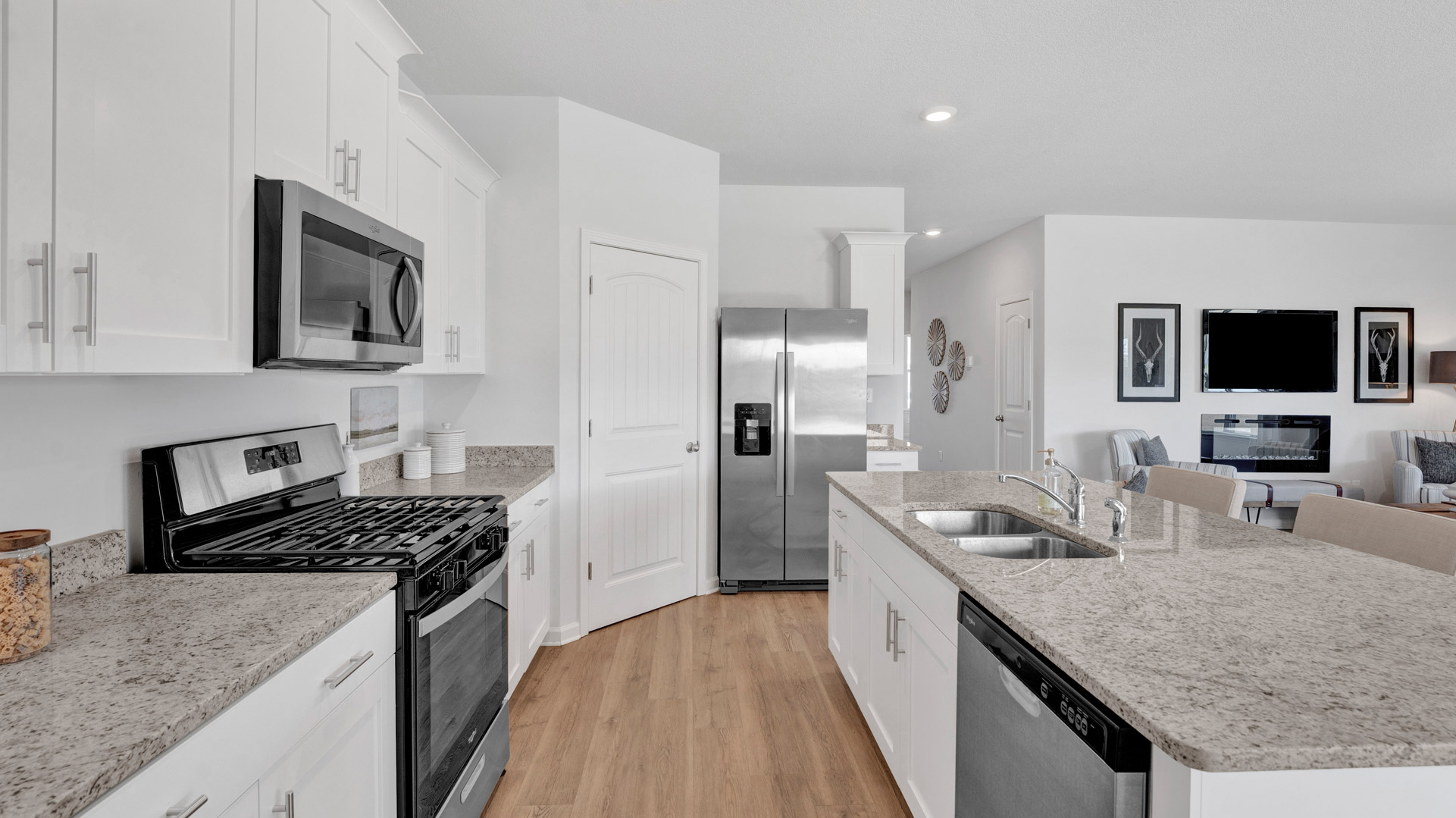 New appliances included, and a larger kitchen island, a sink, seating anchor our kitchen, pantry, near dining, living rooms