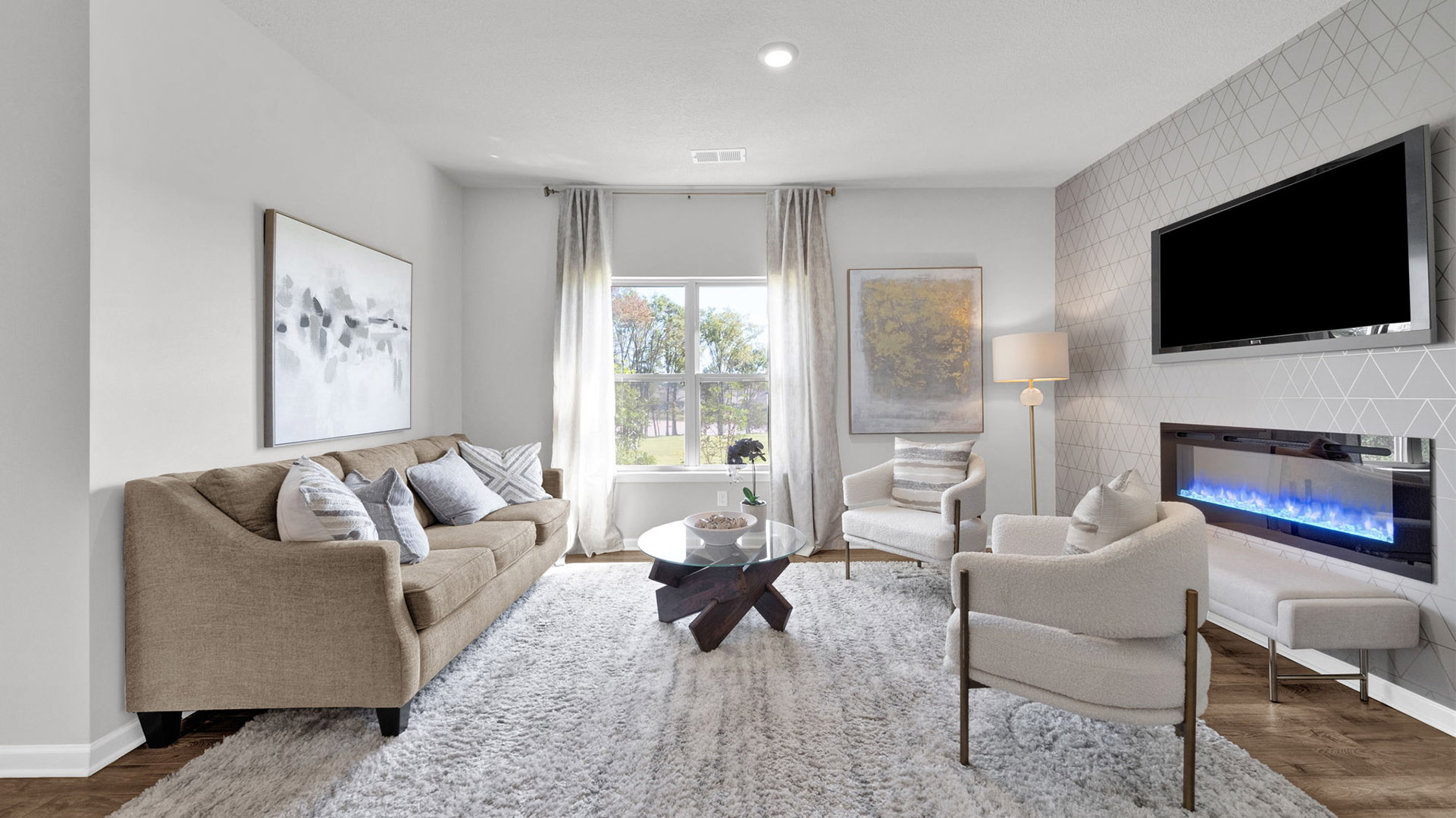Spacious living room with vinyl flooring and neutral walls